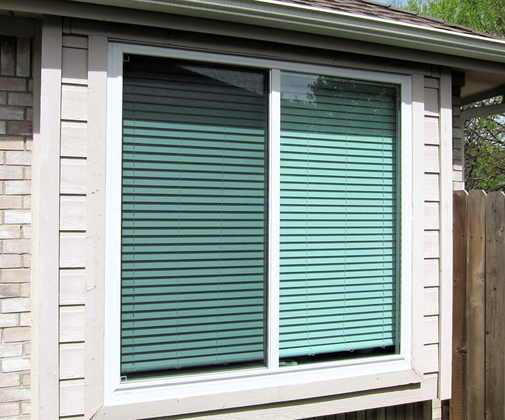 Mulled single hung windows in a single opening