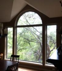This opening has a center picture window with a separate arched top and side windows. It was just too big for one large picture window.