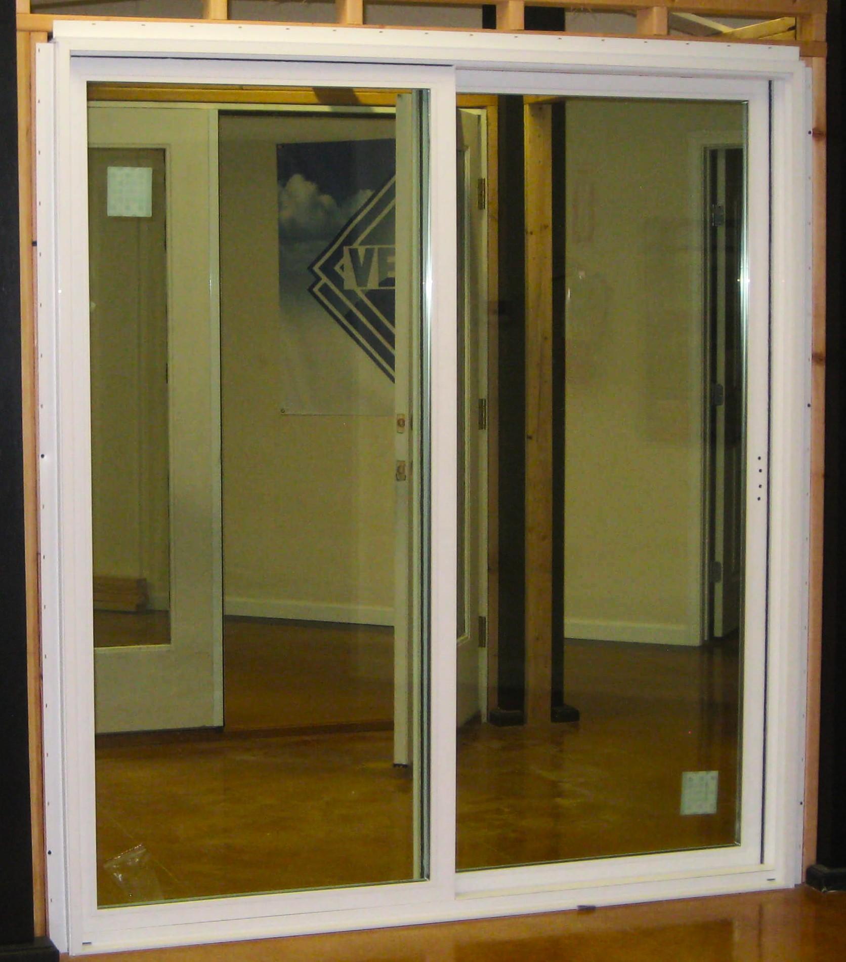 A Ringer Windows sliding patio door secured to an unfinished wall with nail fins