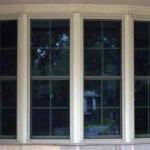 Bay window configuration with Double hung windows with full screens.